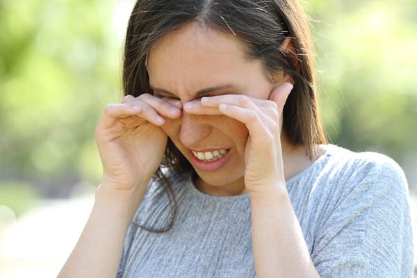 woman suffering from eye allergies