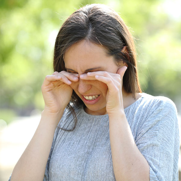 woman suffering from eye allergies
