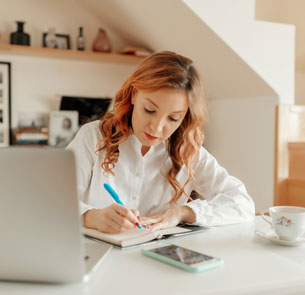 a woman working on a laptop