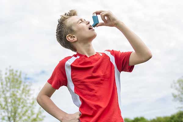 teenager boy in sportswear run outside